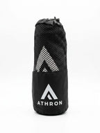 ATHRON gym towel folded into its branded mesh carry pouch