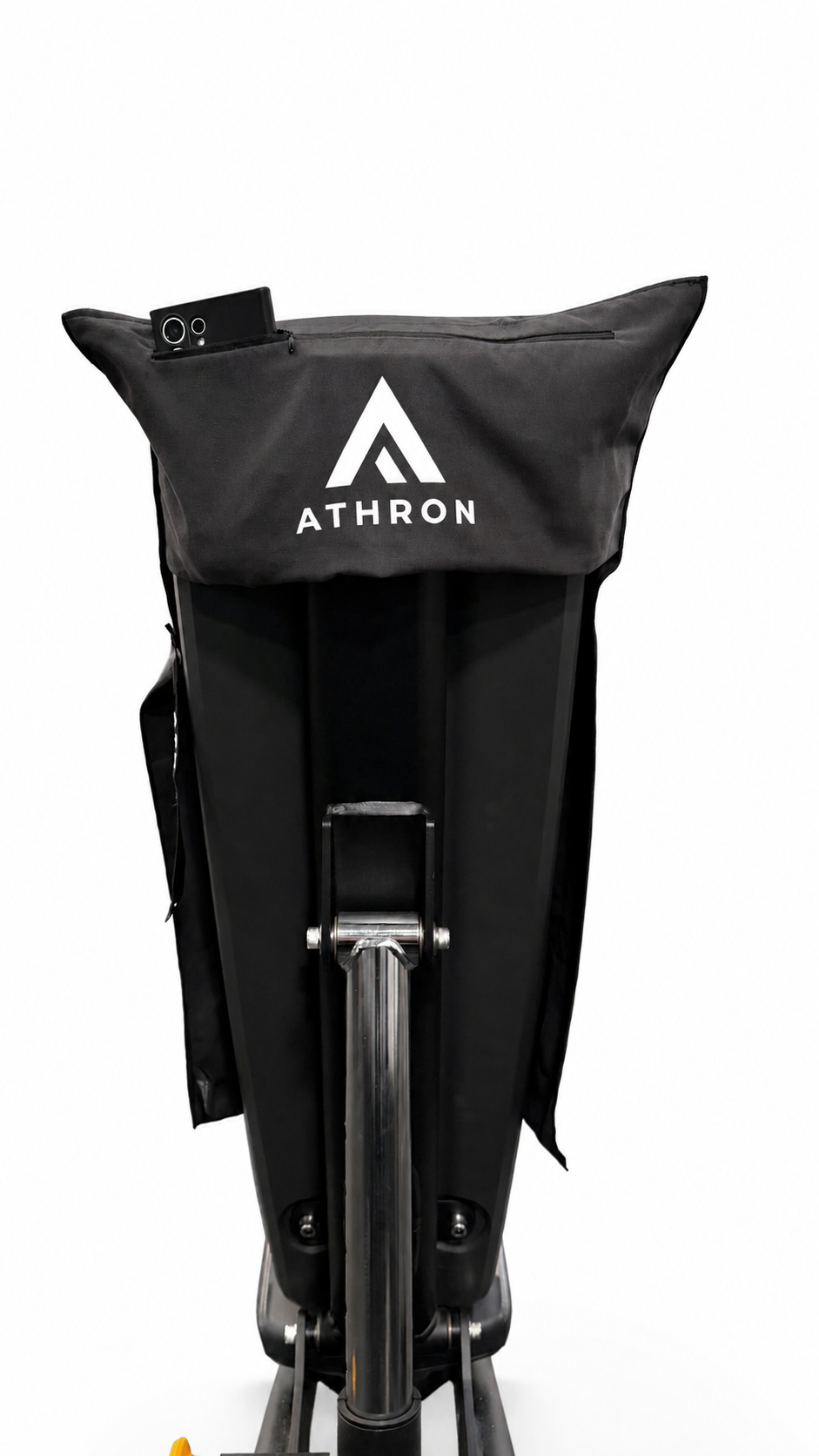 ATHRON gym towel on a bench with a phone in the zipped pocket